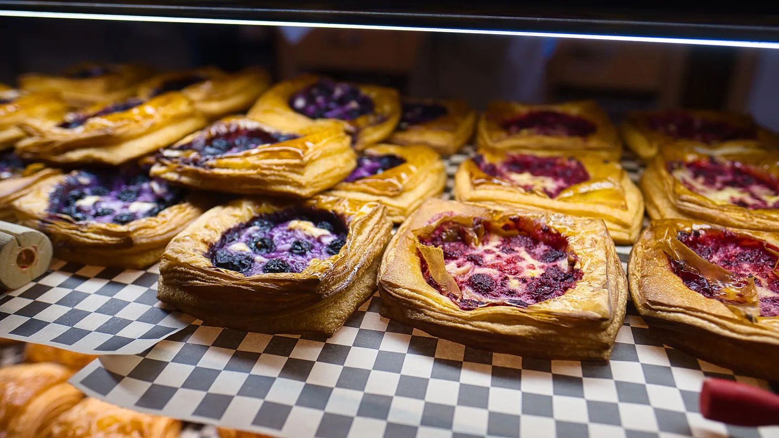 Pastries on display in a bakery case. The photo was not taken in Coral Gables.
