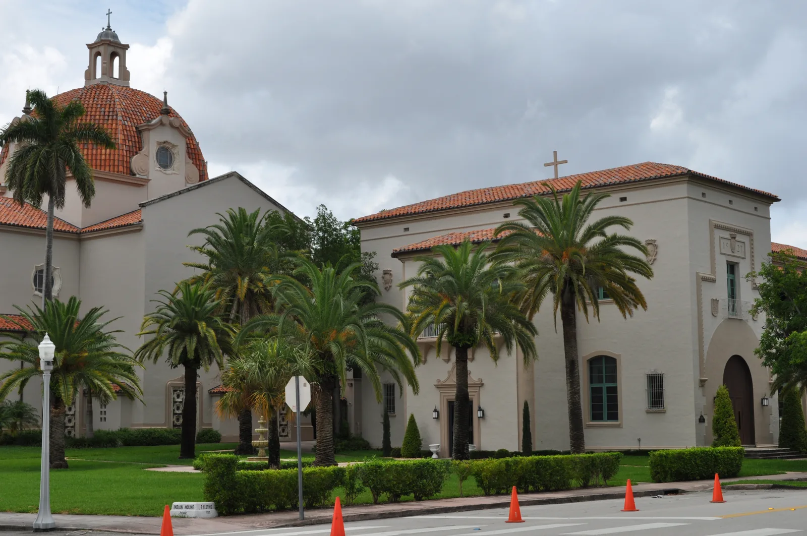 Comber Hall, the parish's first church, beside the dome of Church of the Little Flower in Coral Gables.