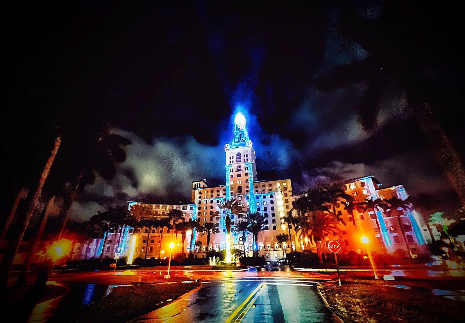 The Biltmore Hotel in Coral Gables lit up at night; GableStage performs in a theater at the hotel.