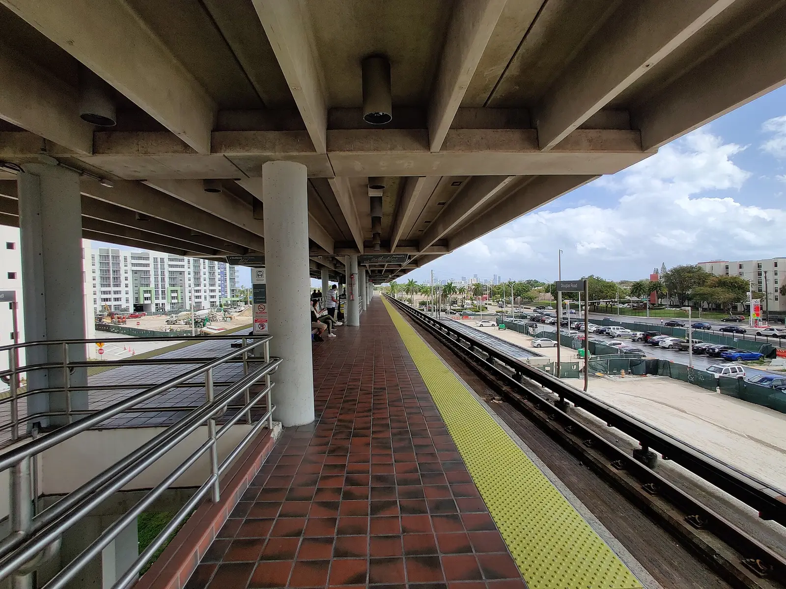 Douglas Road Metrorail station, about a quarter of a mile southeast of the Coconut Grove Section