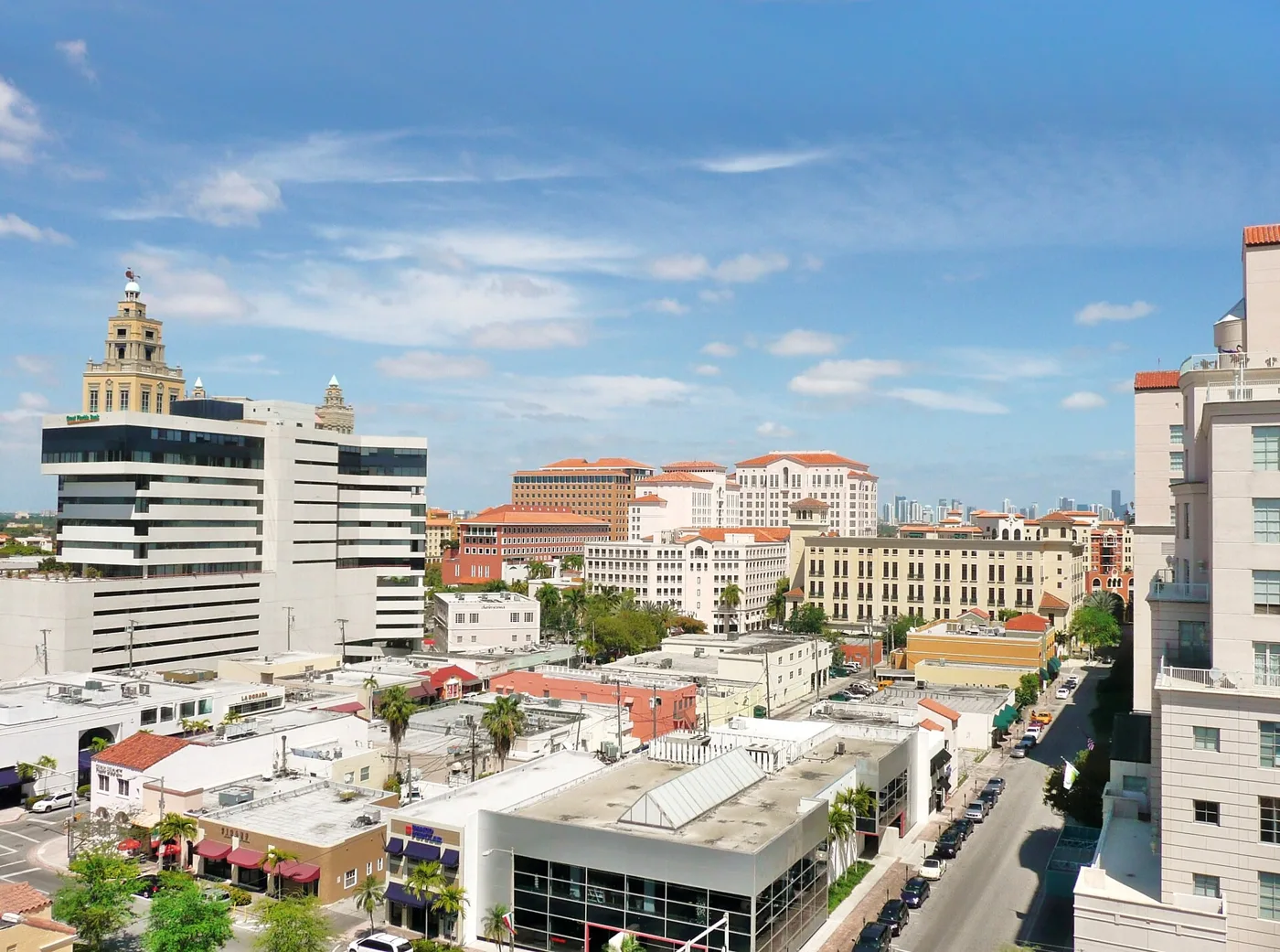 Downtown Coral Gables seen from above, with the city's office towers and the Biltmore tower in the distance.