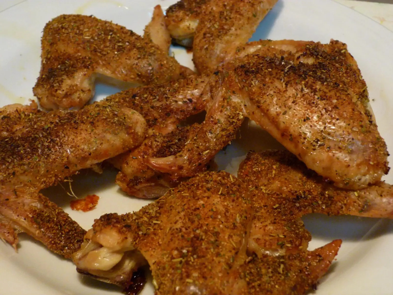 A plate of seasoned chicken wings. The photo was not taken at a Coral Gables restaurant.